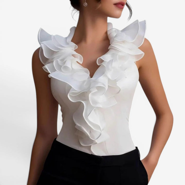 Lorraine™ Top elegante con volant